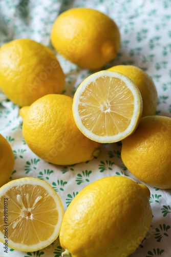 Ripe lemons on a striped fabric background. Vitamin C, healthy eating.