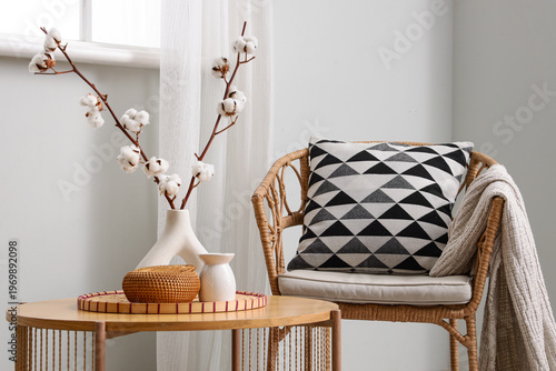 Vase with cotton flowers an...