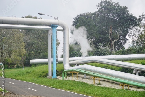 Wallpaper Mural Large piping system with steam emissions outdoors, illustrating industrial processes and energy production. Torontodigital.ca
