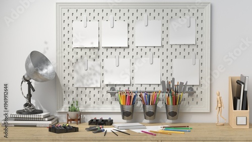 Minimal creative workspace with pegboard wall, art supplies and blank mockups