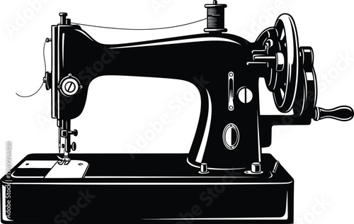 Vintage black sewing machine with hand crank and thread spool retro antique black and white