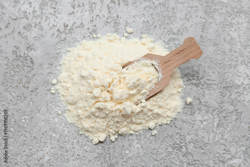 Heap of powdered milk with ...