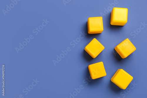 Yellow building cubes on bl...