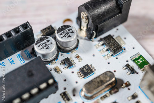 Obraz na płótnie Electronic components capacitors and regulators on printed circuit board macro