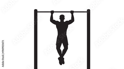 Silhouette of a Muscular Male Athlete Performing a Pull Up on a Horizontal Bar