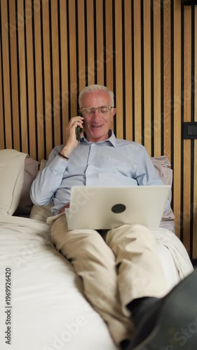 Senior man anticipating future with technology in bedroom