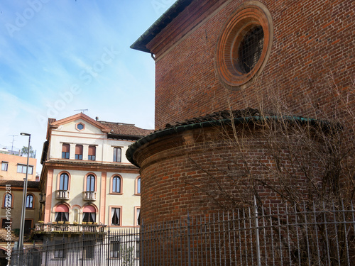 Old residential building along Via Caradosso in Milan, Italy, and Santa Maria delle Grazie church