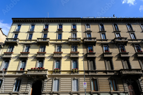 Old residential building along Via Caradosso in Milan, Italy