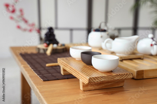 Asian tea set on table in l...