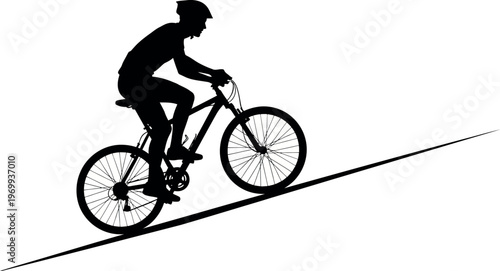 Silhouette of a person riding a bicycle on a road