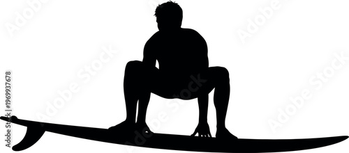 Silhouette of a person sitting on a surfboard
