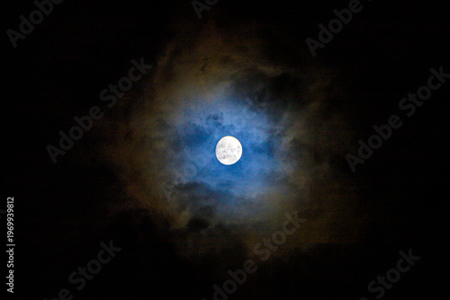 The moon and clouds create a beautiful light.