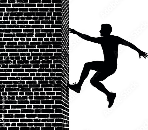 Silhouette of a person climbing a brick wall