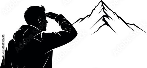 Silhouette of a man looking at a mountain range