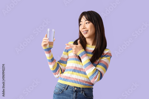 Young Asian woman pointing ...