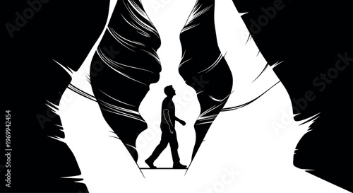 Silhouette of a person standing between two large wings on fire