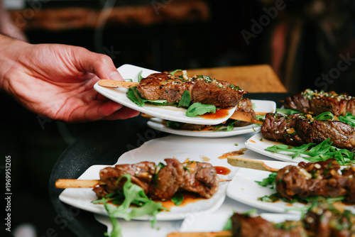 Фотография Horizontal Close-up of Sliced Grilled Entrecote Steak Topped with Peanuts, Chili
