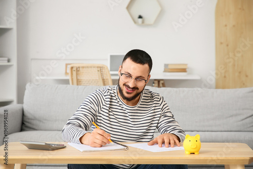 Young man filling out refun...