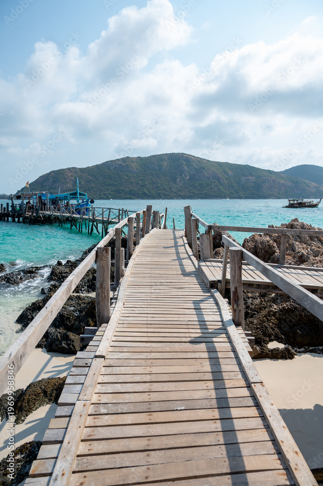 Fototapeta premium Exploring serene coastal pathway tropical island travel photo sunny environment landscape viewpoint