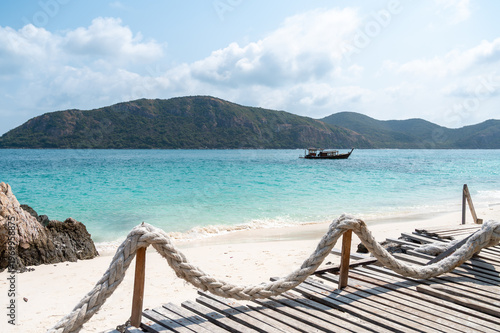 Serene beach scene with boat tropical island photography sunny day coastal view tranquility