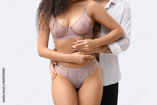 Sexy young couple hugging o...