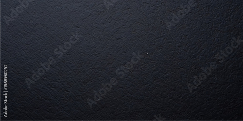 A dark, textured black leather surface features a macro grain pattern, creating a rough material backdrop with a deep grey textile skin for professional design backgrounds