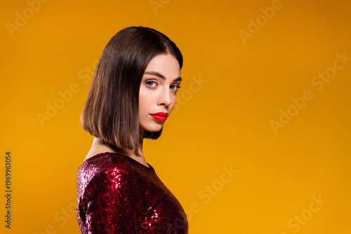 Cuadro en lienzo Fashion portrait of a young female model wearing a red sequin dress and sleek bo