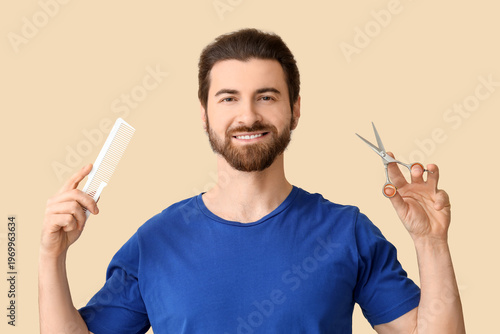 Bearded young man with comb...