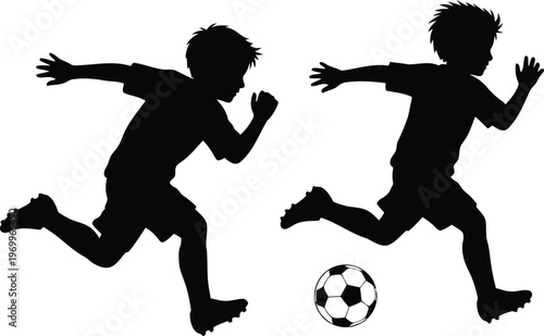 Dynamic silhouette of two young boys playing soccer running with the ball during a game