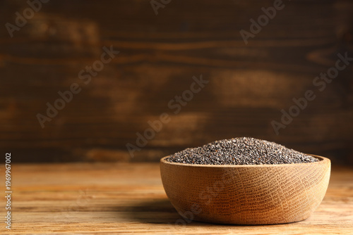 Bowl with chia seeds on woo...