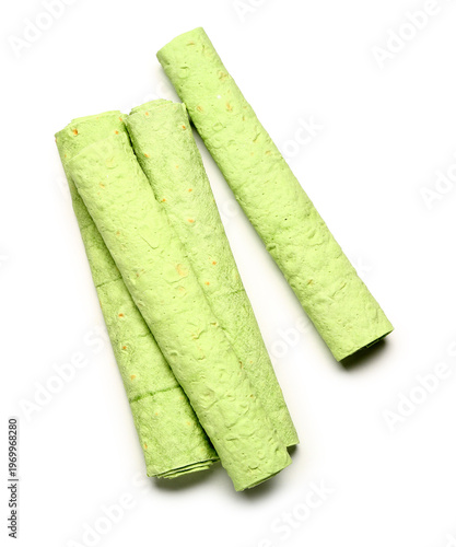 Rolled green lavash on whit...