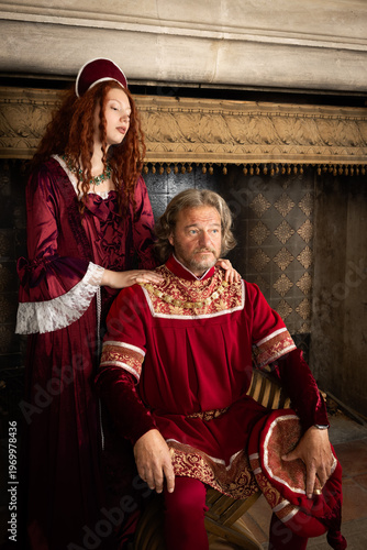Renaissance king and queen sitting;