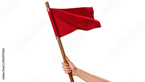 Fotografie Human hand firmly grasping a waving red flag attached to a wooden pole
