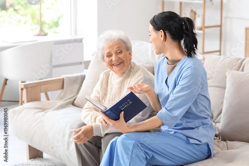 Caregiver and senior woman ...