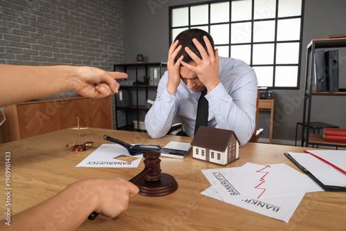 Judge pointing at bankrupt ...