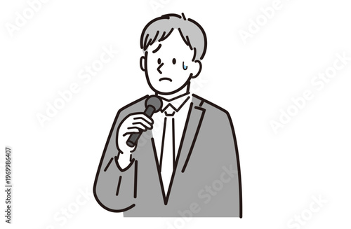 マイクを持って困っているスーツを着た男性