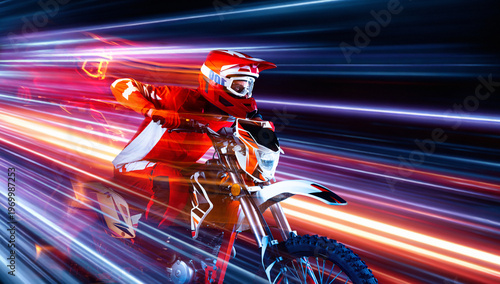 Tablou pe pânză Motocross rider speeding through colorful light streak motion background