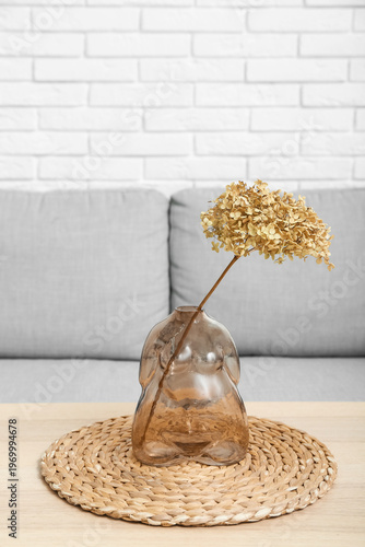 Vase with dried hydrangea a...
