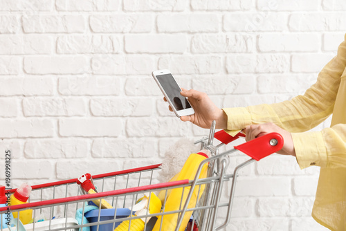 Woman with shopping cart fu...