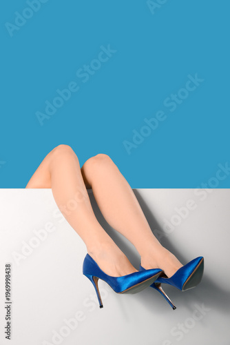 Legs of young woman in eleg...