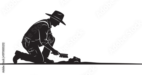 Archaeologist Silhouette or paleontologist wearing a distinctive wide-brimmed hat kneels, meticulously using a small brush to uncover a valuable ancient skull or historical fossil artifact.