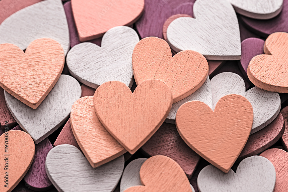 Obraz premium Valentines day background with pile of wooden hearts
