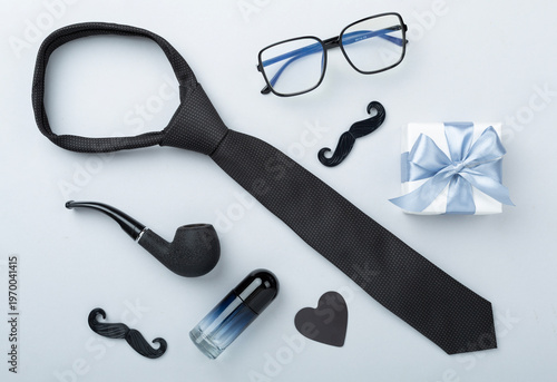 Happy Father's Day accessories on color background, top view