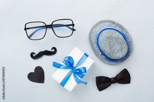 Happy Father's Day accessories on color background, top view