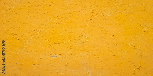 A vintage grunge design featuring a rough old yellow paint texture on a weathered concrete wall surface with a dirty plaster material pattern