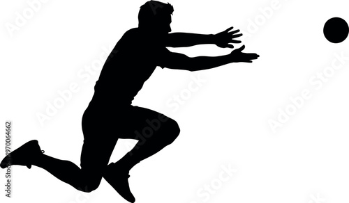 Silhouette of a person jumping to catch a ball in mid air