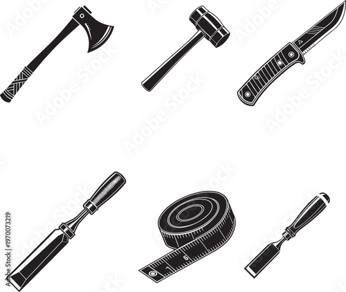 A collection of vintage hand tools including axes knives chisels and a measuring tape