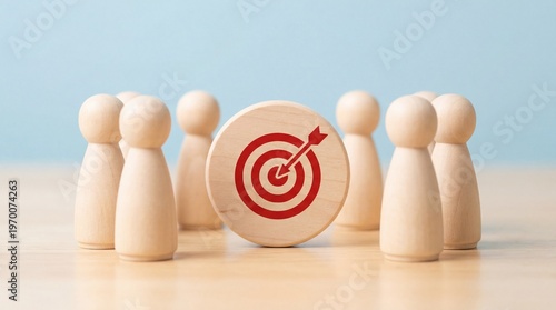 Symbolic wooden figures illustrate teamwork and leadership in setting clear business goals, aiming for successful execution with a bullseye target.