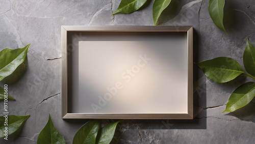 Empty Wooden Frame on Cracked Stone Surface with Fresh Green Leaves