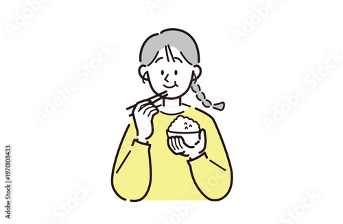 ご飯を食べている女性